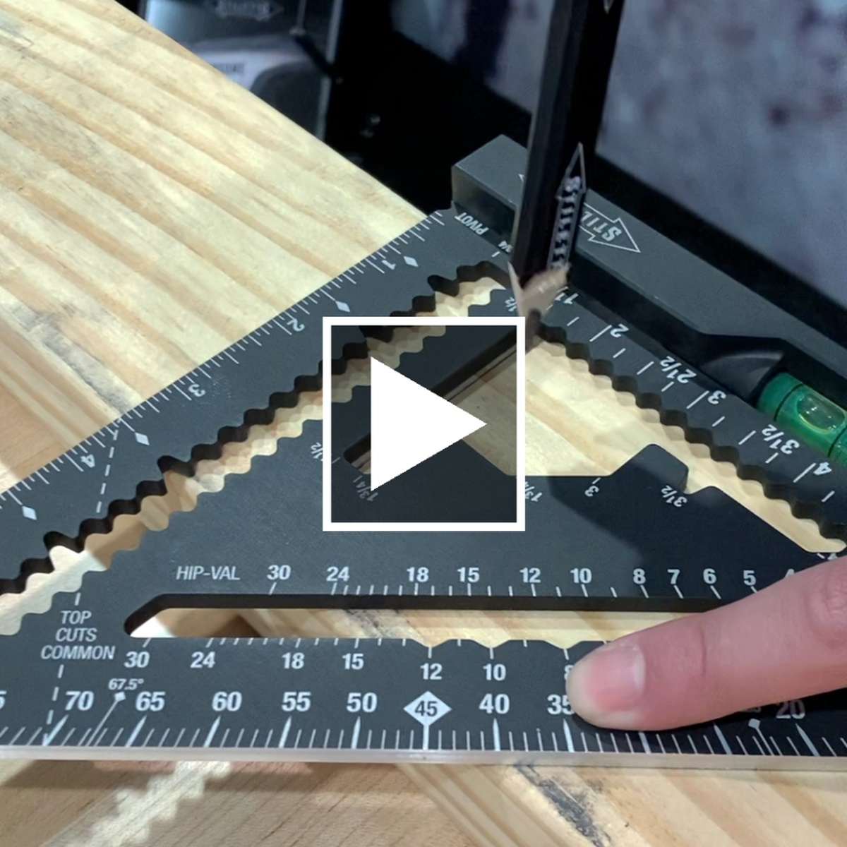 Stiletto 7 in Carpenter Square marking a layout line on framing lumber on a workbench during carpentry setup