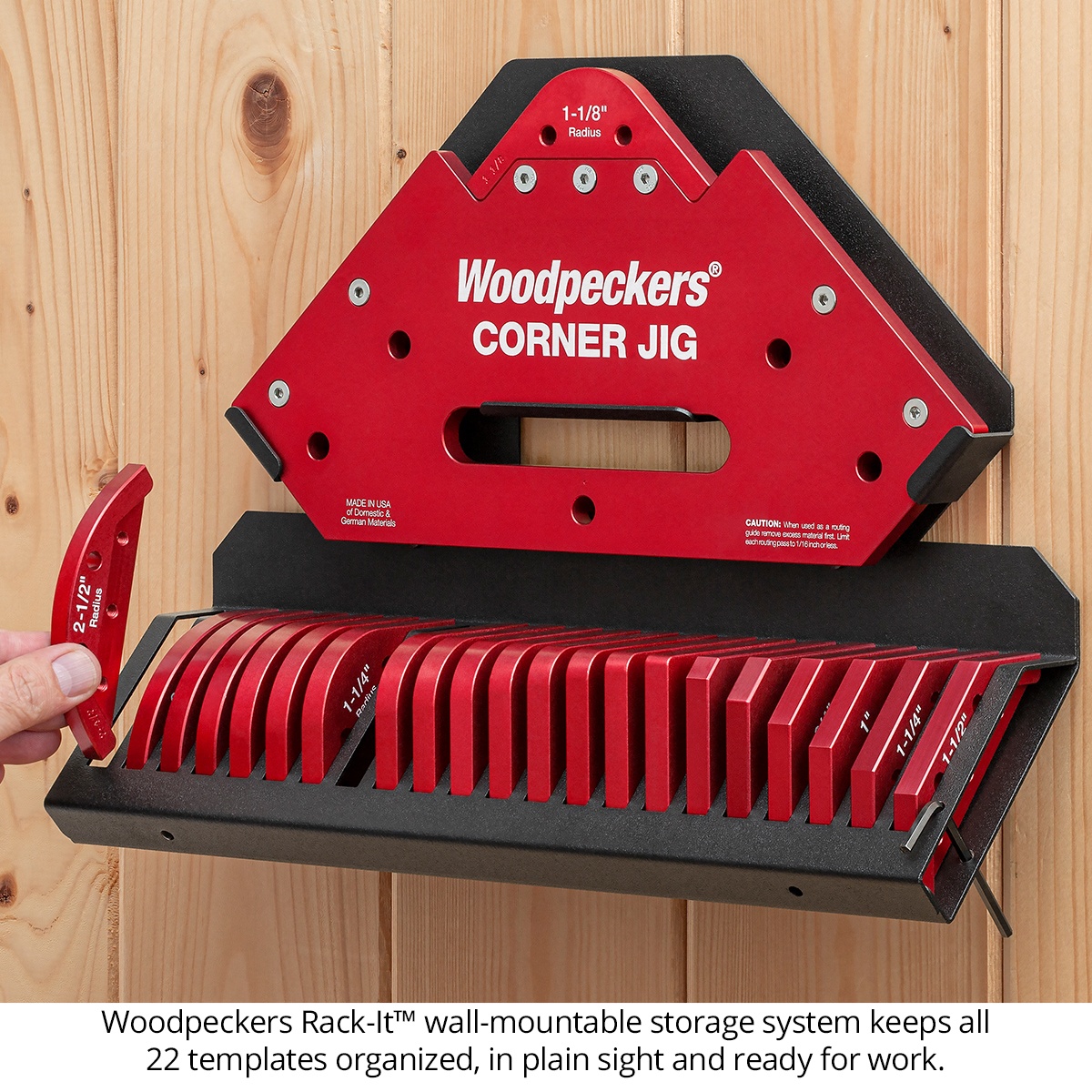 Woodpeckers Corner Jig Deluxe Set with Rack-It wall-mounted storage holding 22 corner templates in a woodworking shop