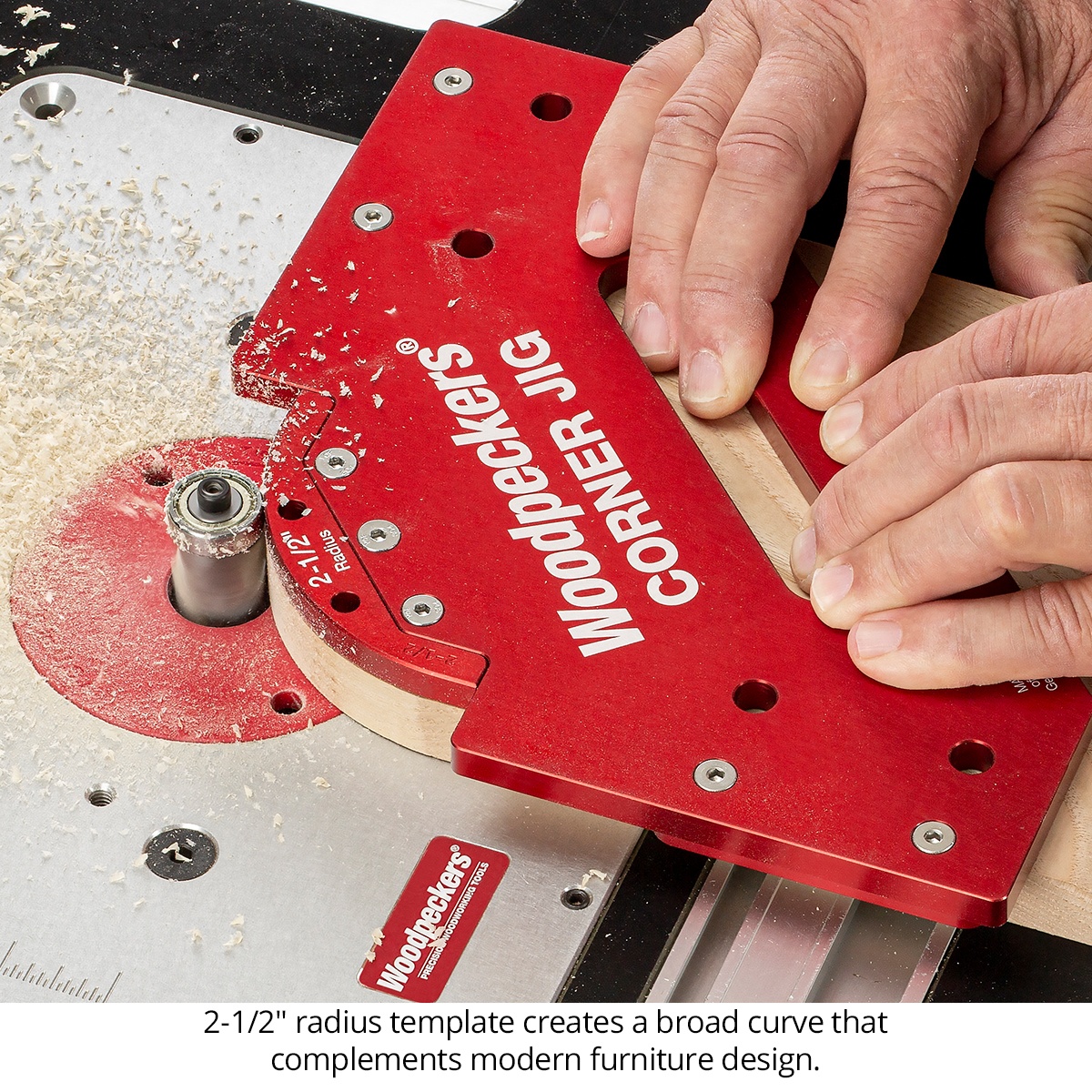 Woodpeckers Corner Jig Deluxe Set routing a rounded corner on a wood workpiece at a router table for furniture making