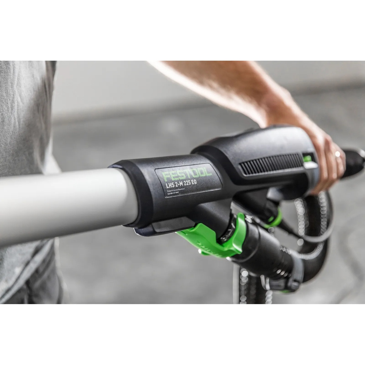 Festool 577359 PLANEX LHS 2-M 225 EQ Long-Reach Sander handle and dust hose connection shown during drywall sanding setup