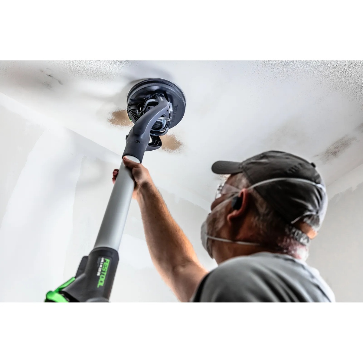Festool 577359 PLANEX LHS 2-M 225 EQ Long-Reach Sander sanding a drywall ceiling during interior finishing work