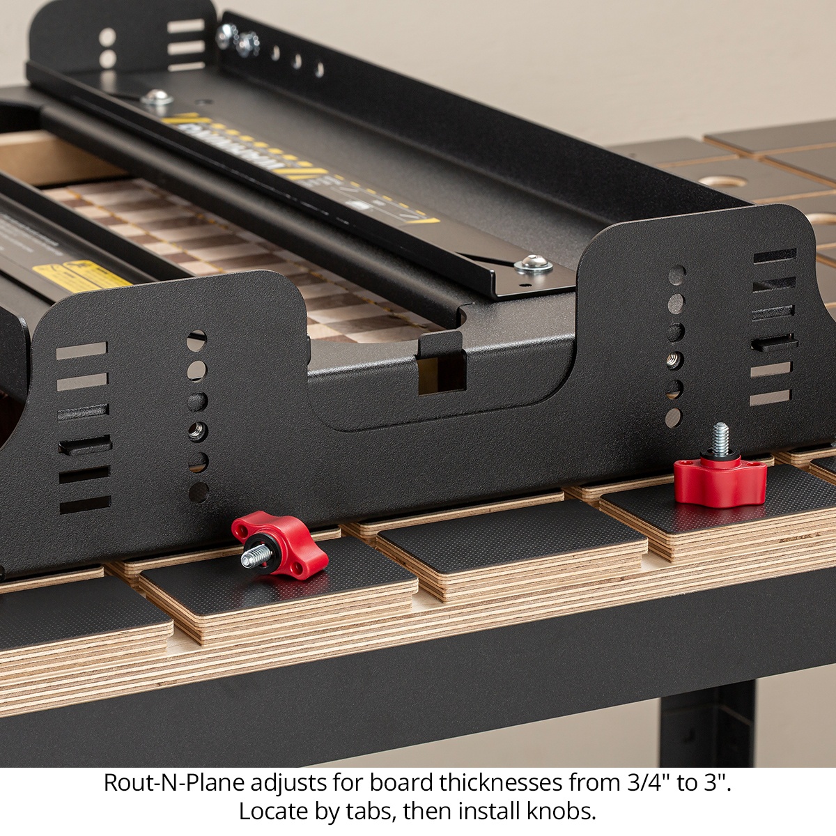 Woodpeckers Rout-N-Plane XL Bench Top Board Mill side adjustment points showing thickness setup on a workbench