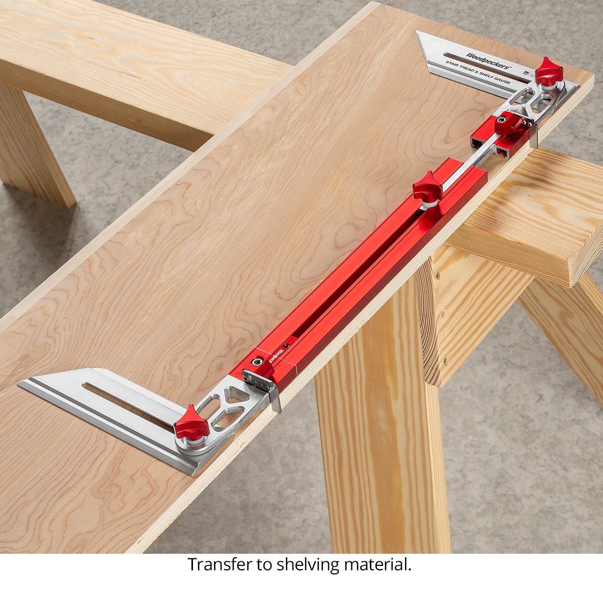 Woodpeckers Stair Tread & Shelf Gauge laid across shelf stock to transfer an exact wall-to-wall fit onto shelving material at the workbench