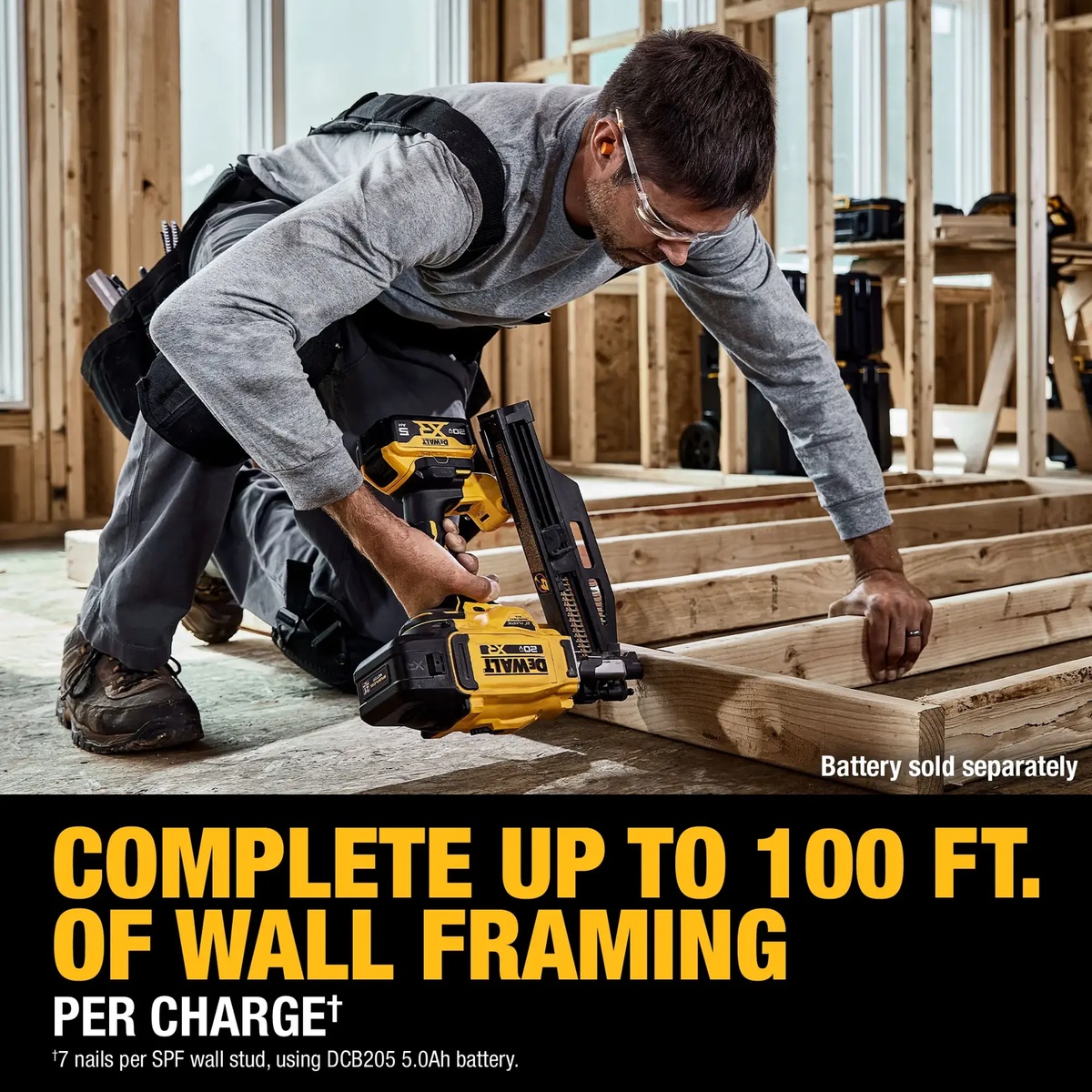 DEWALT DCN920B 20V MAX XR Brushless Cordless 21 Degree Plastic Collated Framing Nailer driving nails during wall framing on a wood floor assembly at an indoor construction site