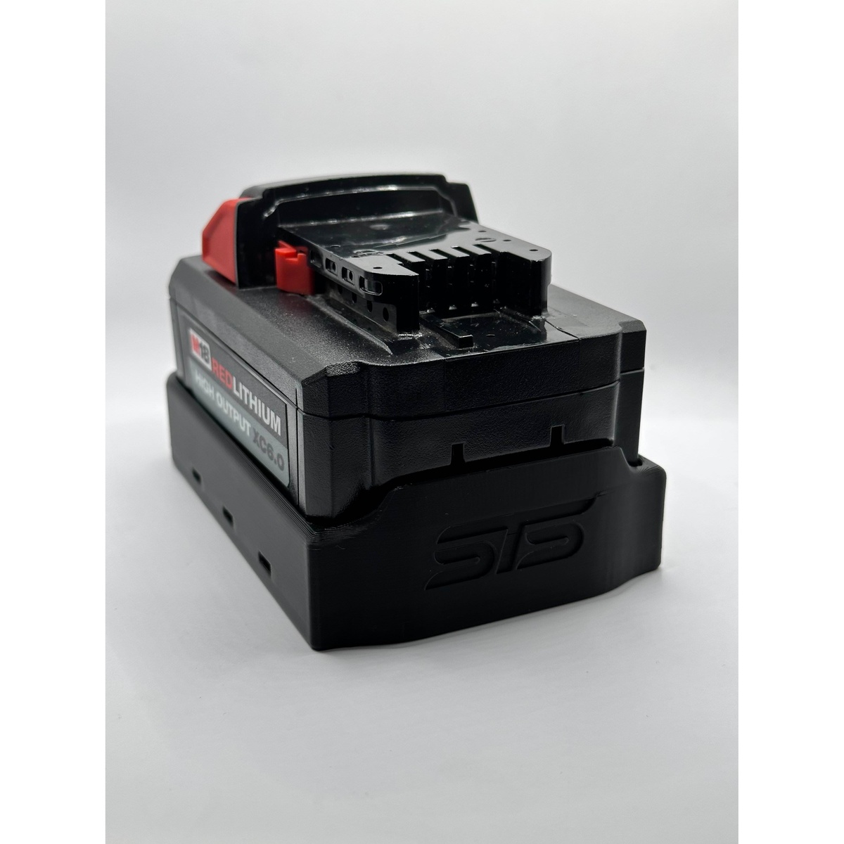 STS Auto Design M18H6 Milwaukee M18 Hi-Output 6.0Ah 8.0Ah Magnetic Battery Cover showing the battery interface and molded base on a white background