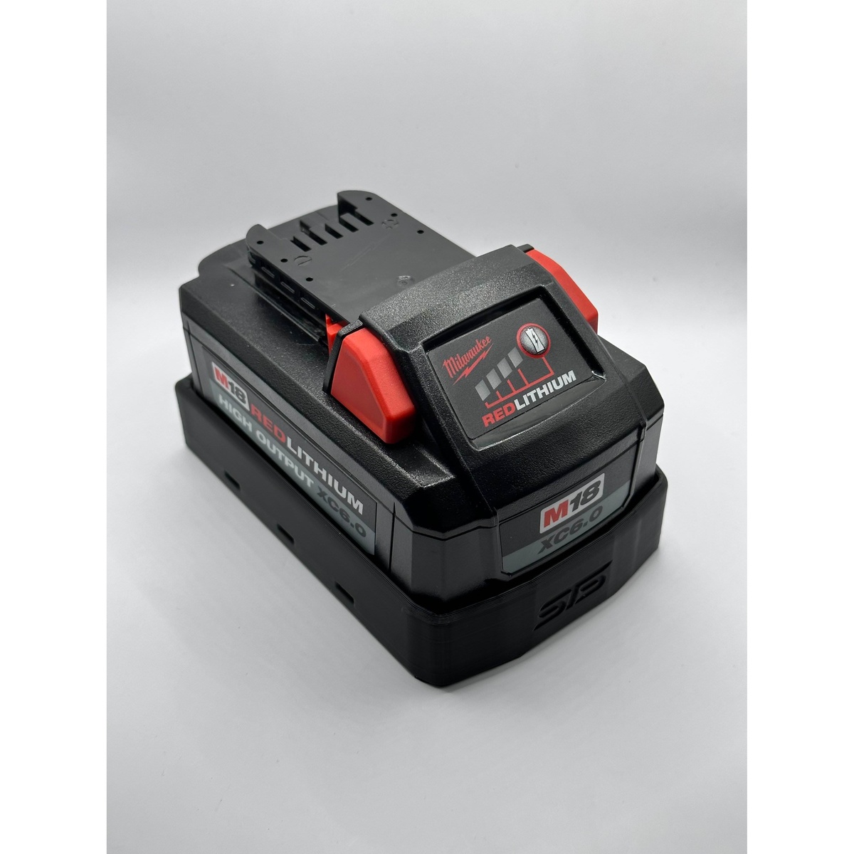 STS Auto Design M18H6 Milwaukee M18 Hi-Output 6.0Ah 8.0Ah Magnetic Battery Cover installed on a Milwaukee M18 High Output XC6.0 battery on a studio background