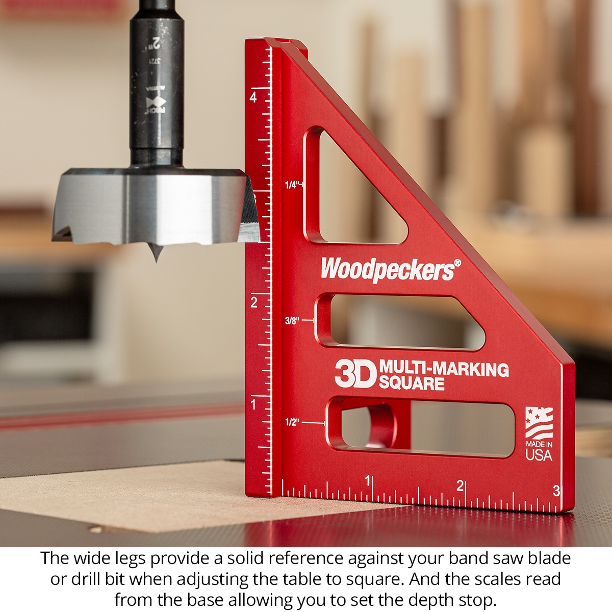 Woodpeckers 3D Multi-Marking Square used beside a drill bit on a machine table to check setup and depth in a wood shop