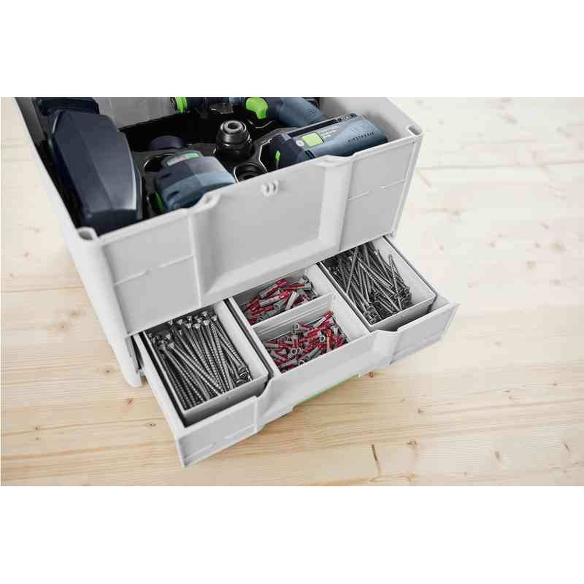 Festool 577766 SYS3-COMBI M 287 Systainer drawer open on a bench showing sorted screws, anchors, and small hardware below stored power tools
