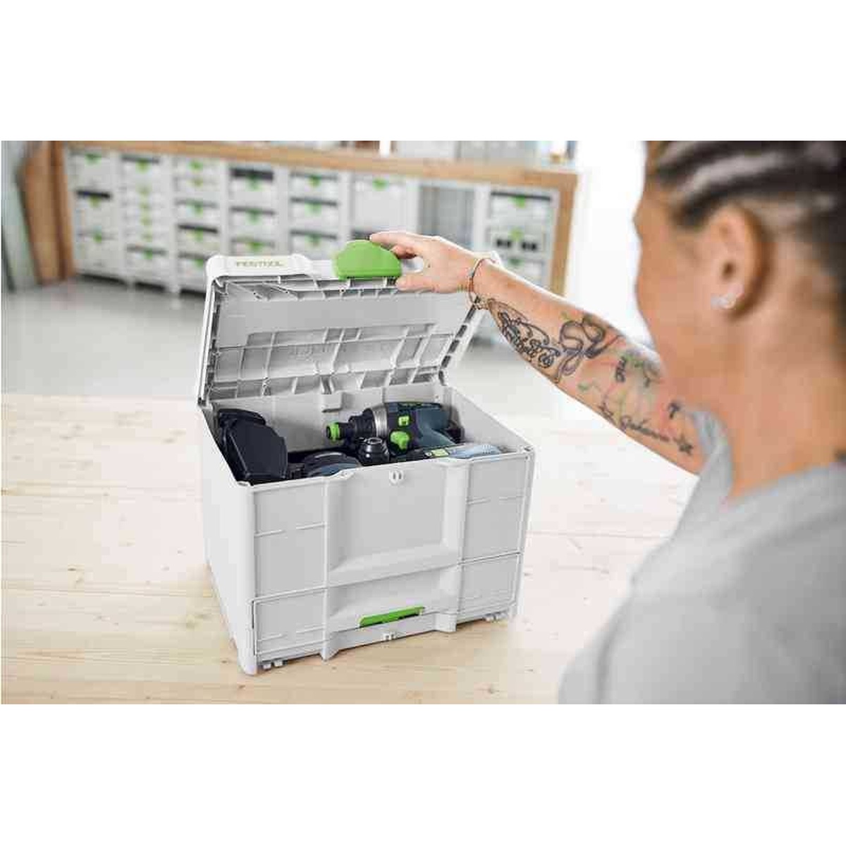 Festool 577766 SYS3-COMBI M 287 Systainer opened on a workbench with cordless tools stored in the top compartment in a workshop setup
