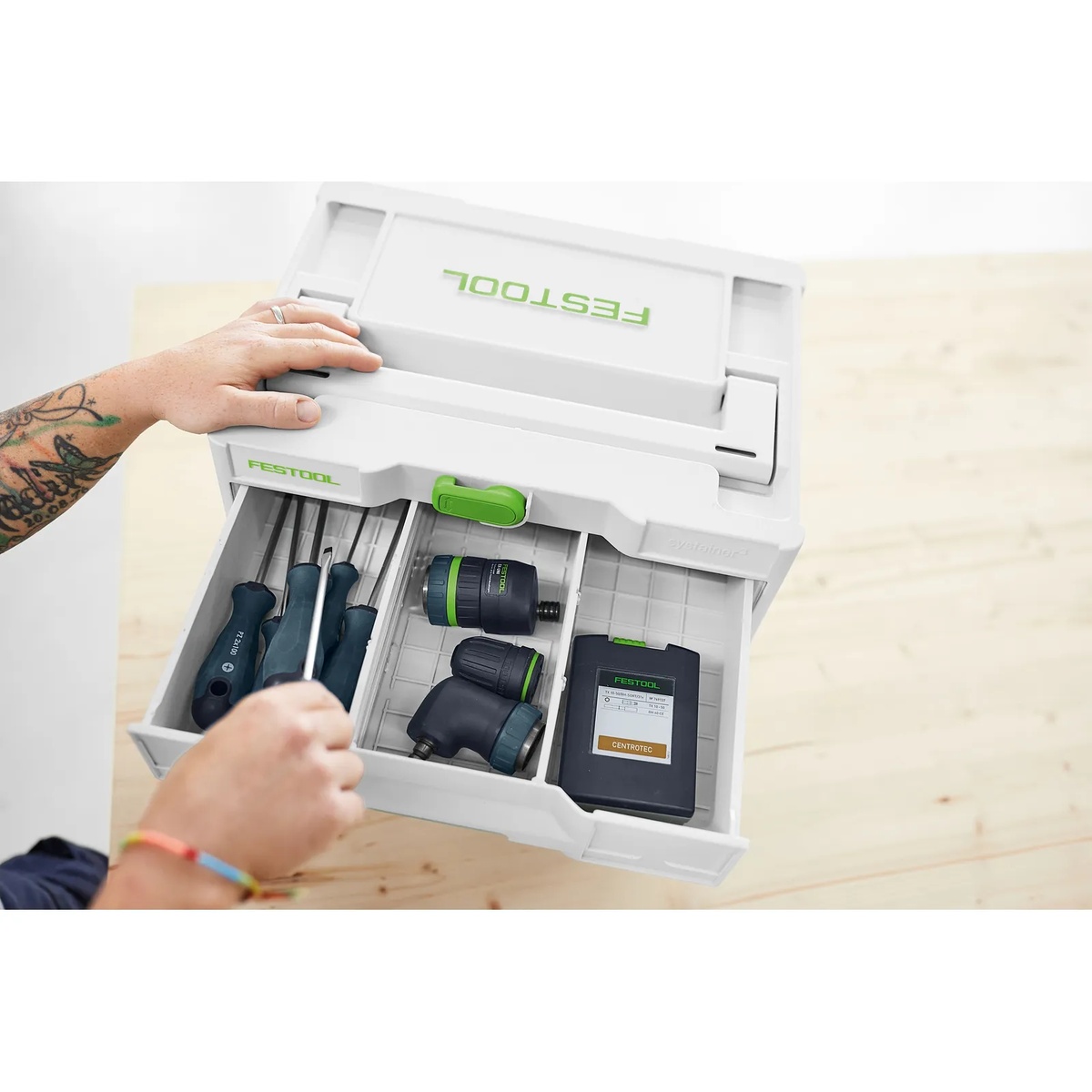 Festool 577770 SYS3-SORT/2 M 337 Systainer open on a workbench with screwdrivers and tool accessories organized in the lower drawer for workshop storage