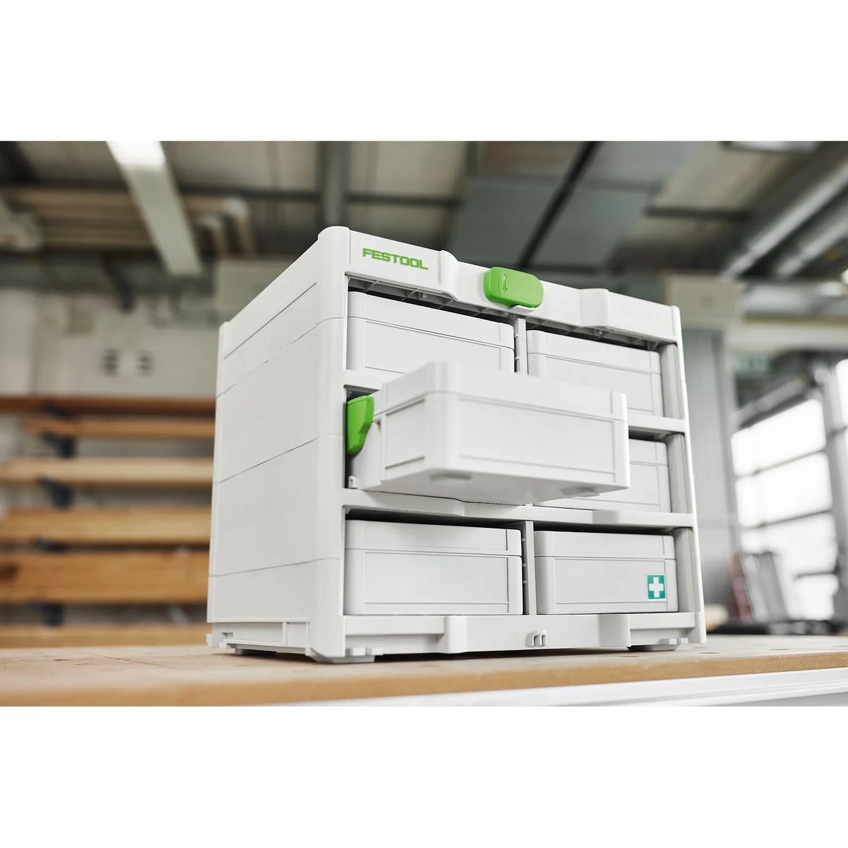 Festool 577808 SYS3 S 76 Mini Systainer installed in a Systainer rack on a workshop bench for modular parts storage