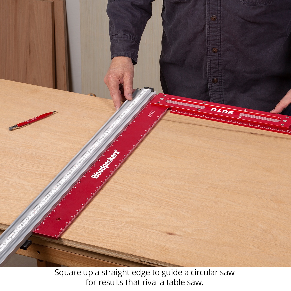Woodpeckers Precision Woodworking Squares used to square a straightedge on a plywood work surface for circular saw cutting in a woodworking shop