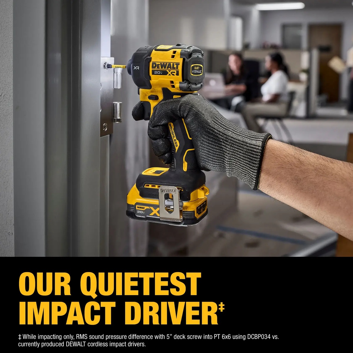DEWALT 20V MAX XR 1/4 Inch Quiet Hydraulic Impact Driver Kit driving a screw into a metal door frame in an occupied indoor workspace