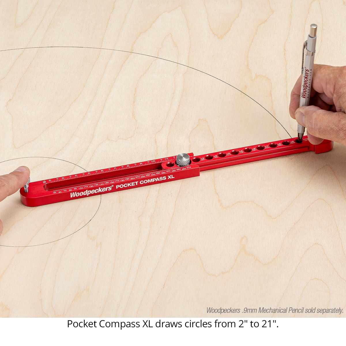 Woodpeckers Pocket Compass XL drawing a large circle on plywood for woodworking layout in a shop