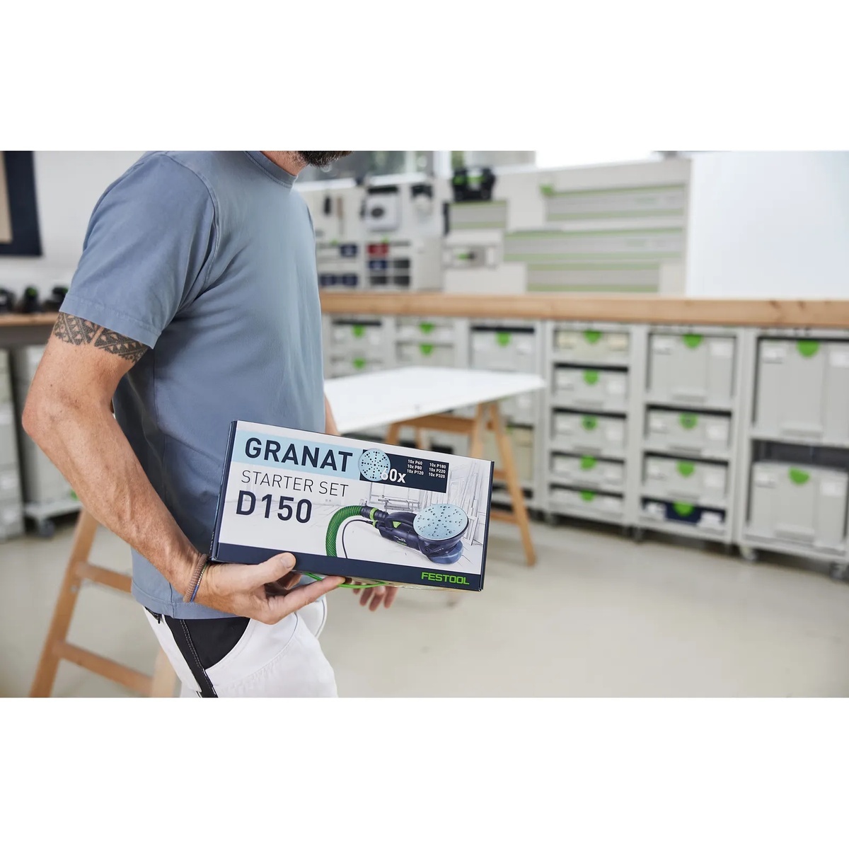 Festool 578166 D150 Granat starter set box carried into a workshop for sanding and finishing prep with Festool 150 mm sanders