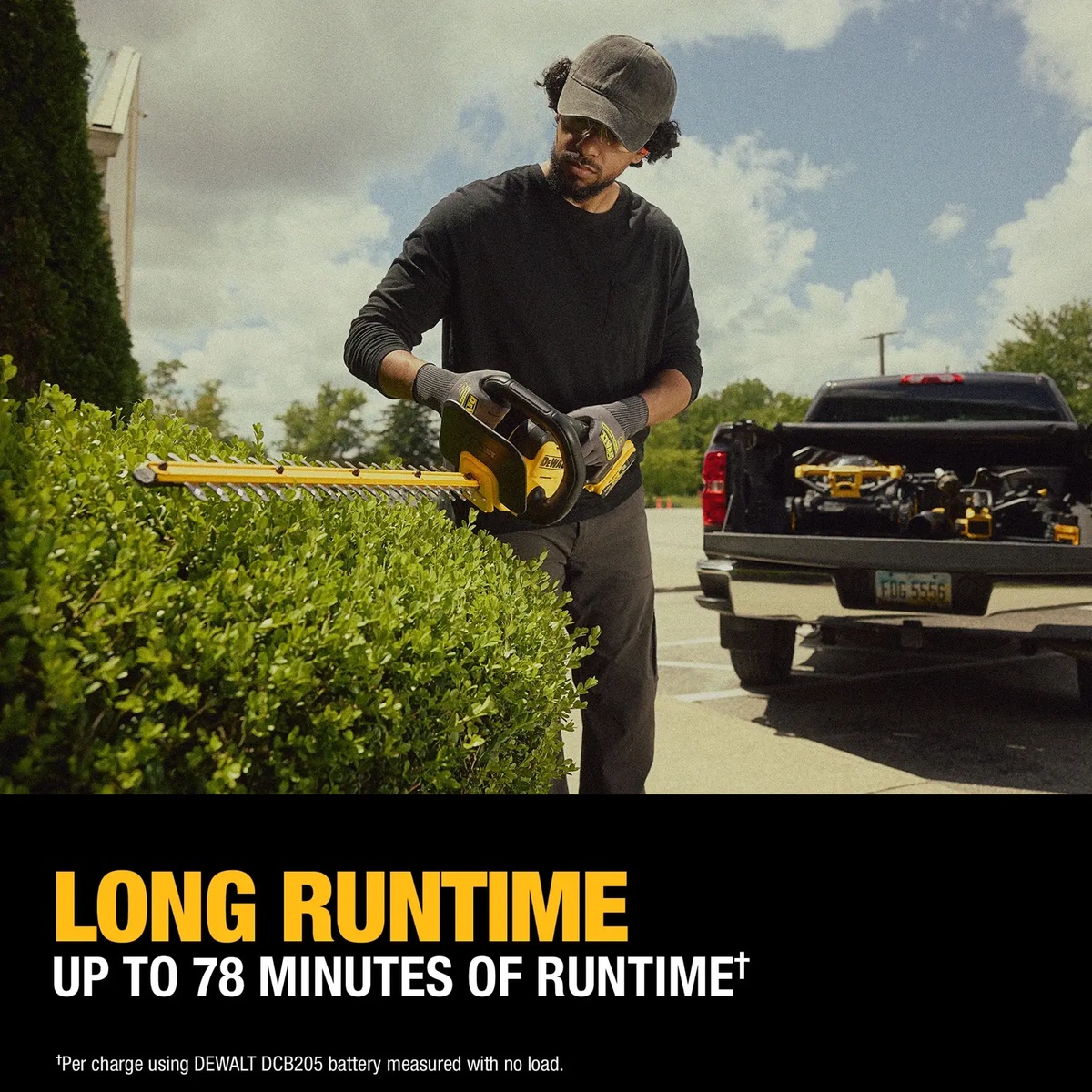 DEWALT 20V MAX 22-in. Cordless Hedge Trimmer Kit trimming a hedge on a residential property with a pickup truck parked nearby during outdoor landscape maintenance