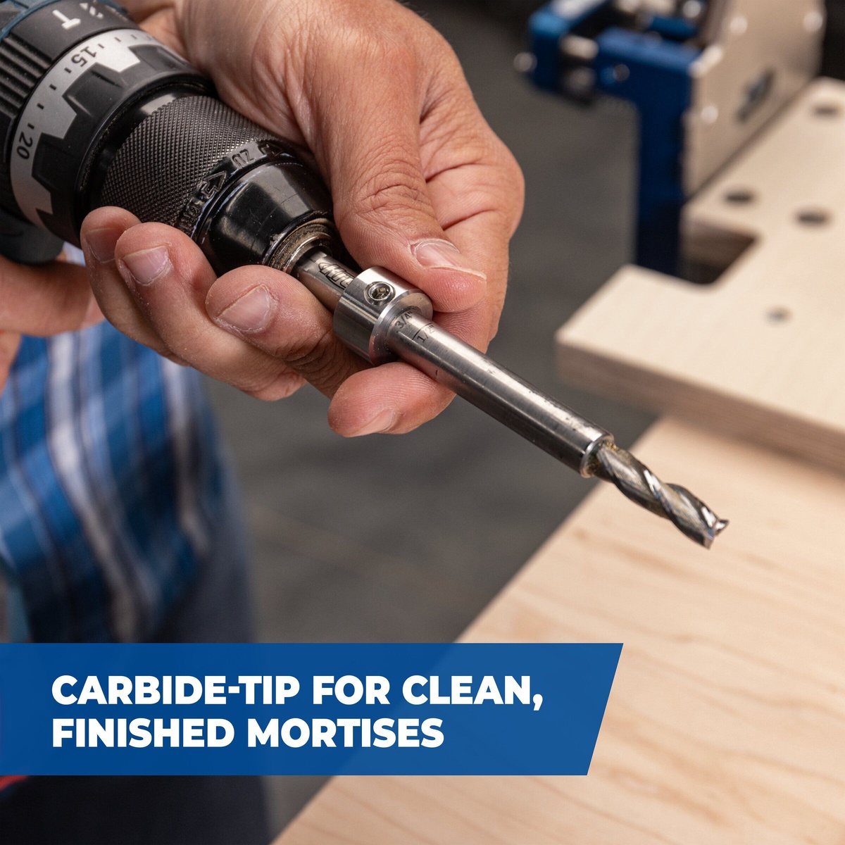 Kreg Tool KLTJC-M10 mortise bit installed in a drill for loose tenon joinery on a woodworking bench, showing the carbide-tipped cutter used to cut clean mortises in wood