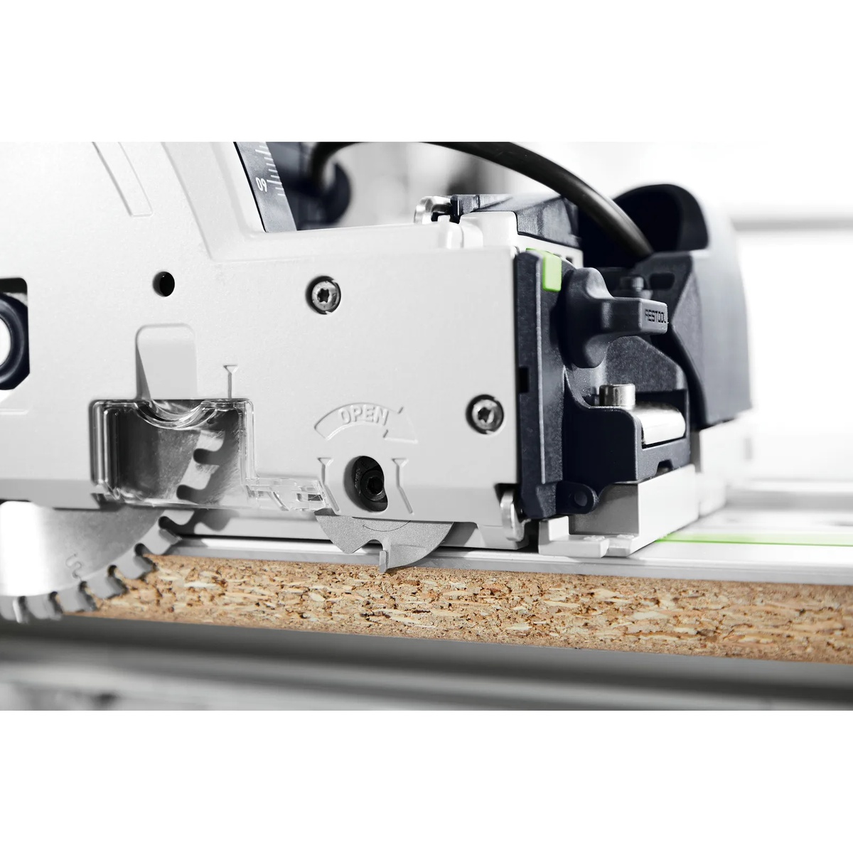 Festool TSV 60 K track saw using the scoring saw blade on a guide rail to cut chipboard cleanly in a workshop setting