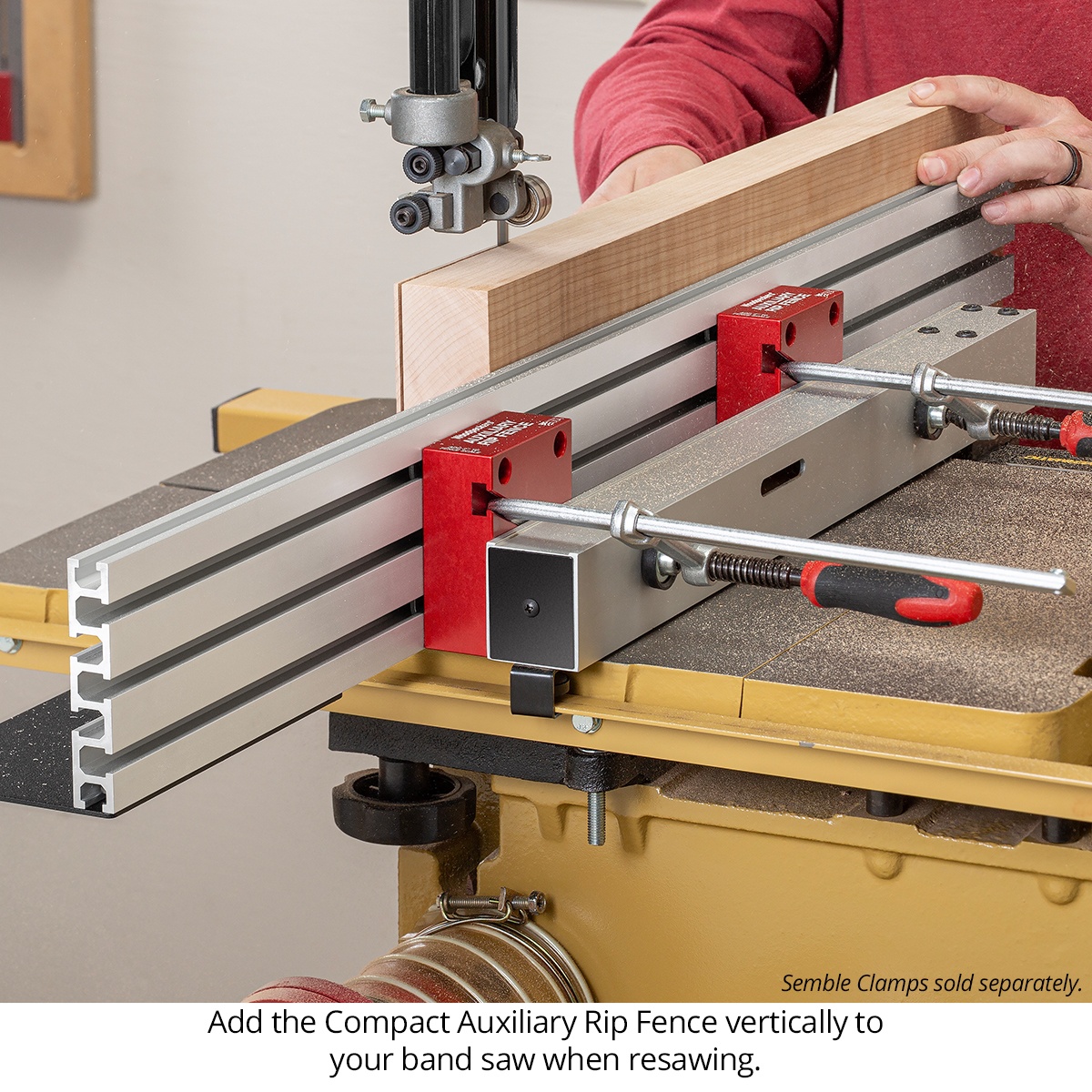 Woodpeckers Compact Auxiliary Rip Fence mounted vertically on a band saw for resawing a tall hardwood board in a woodworking shop