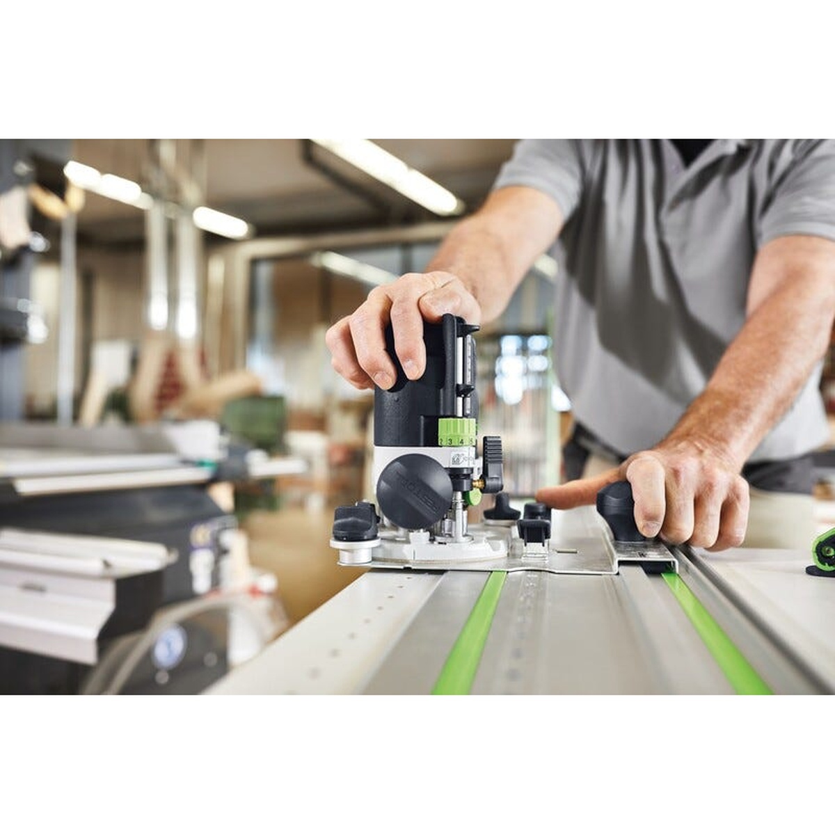 Festool 578307 OF 1010 REBQ-Set Router w/ ZS-OF 1010 I Accessory Set used with a guide rail for straight routing in a professional woodshop