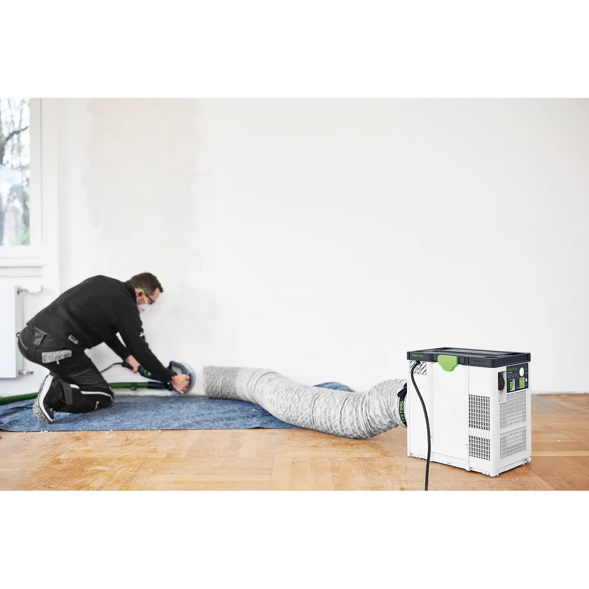 Festool 577964 SYS-AIR Air Supply Hose LS-SYS-AIR D200x6m used with a SYS-AIR air filter in a room during dust-generating renovation work