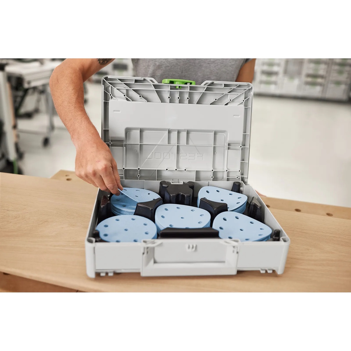 Festool 578193 Granat D125 Abrasives 100-Piece Value Set Systainer3 opened on a workbench with sanding discs sorted by grit for quick selection in a shop setting