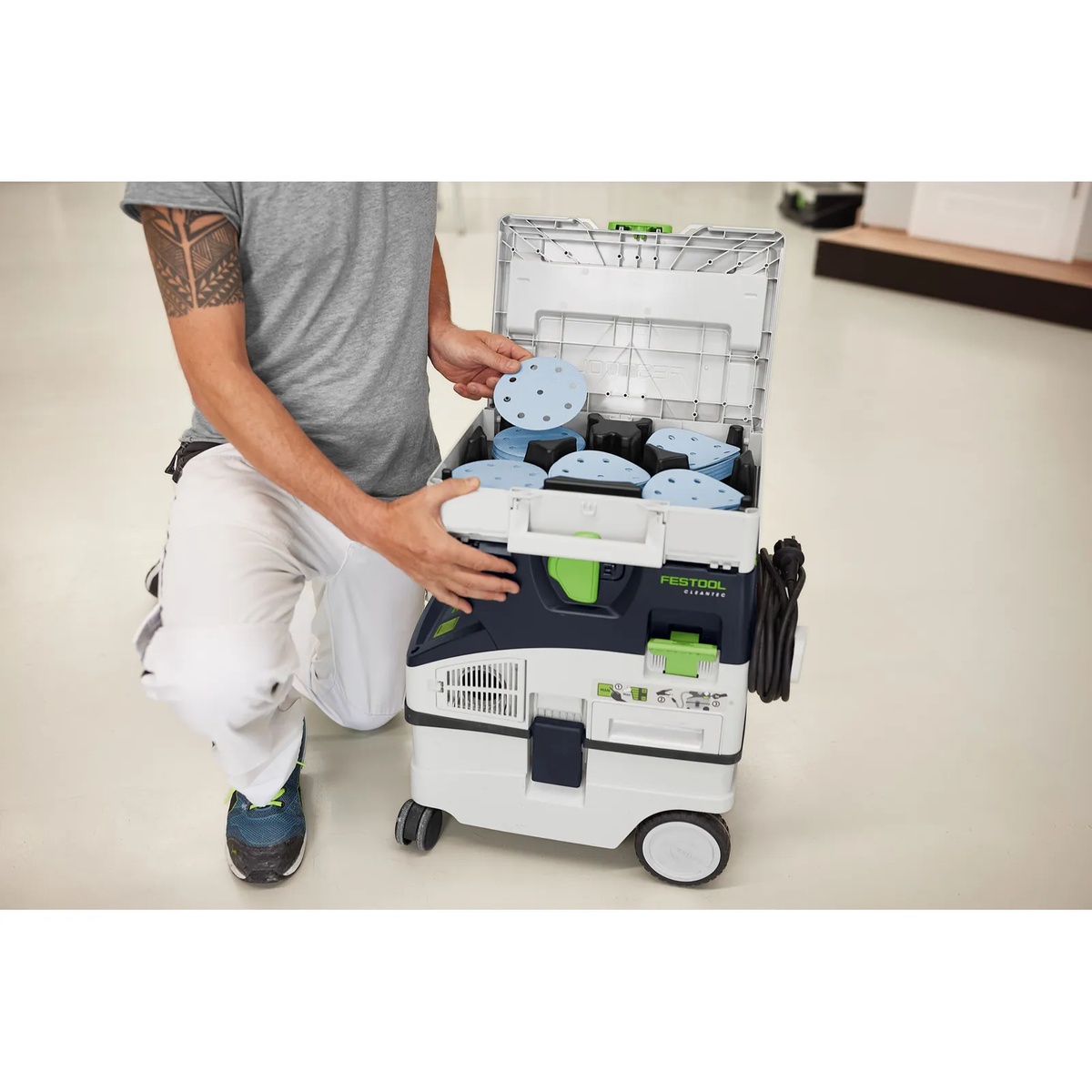 Festool Granat D125 abrasives Systainer mounted on a Festool dust extractor for organized transport between workshop and jobsite