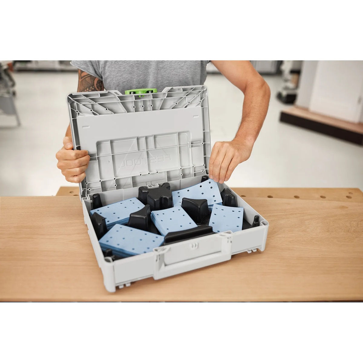 Festool 578194 Granat RTS/RTSC/LS130 80x133 Abrasives 100-Piece Value Set Systainer3 opened on a workbench with abrasive sheets sorted inside for quick grit selection during sanding prep