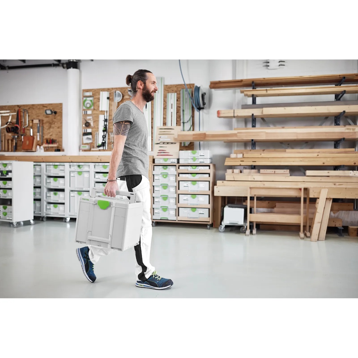 Festool 578281 D225 GR SYS Granat Abrasives Systainer being carried through a workshop for jobsite transport and organized abrasive storage
