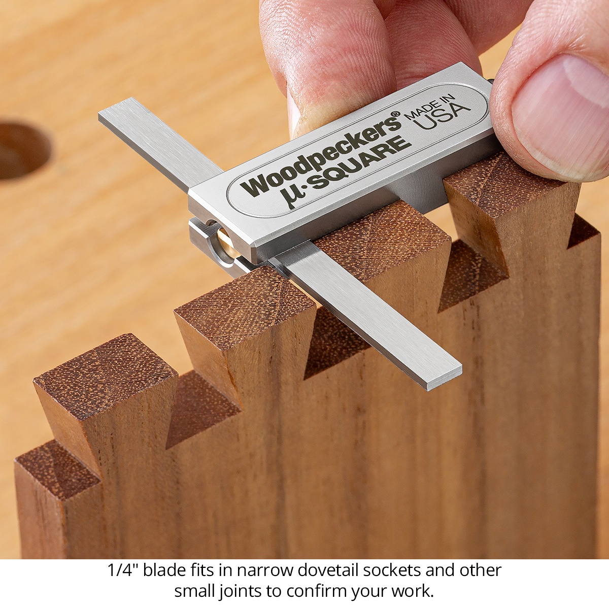 Woodpeckers Micro-Combination & Micro-Double Square Combo checking narrow dovetail sockets on a woodworking joint at the bench