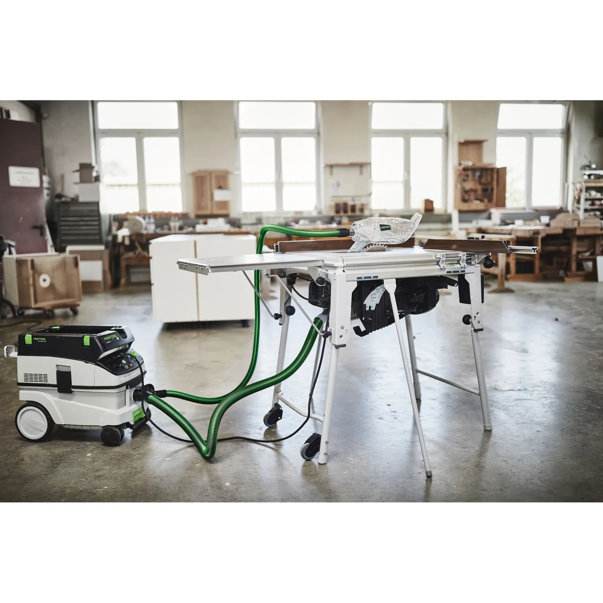 Festool 577280 AB-AS CS/TKS Dust Extraction Hose Set connected to a Festool table saw and CT mobile dust extractor in a woodworking shop for low-dust cutting