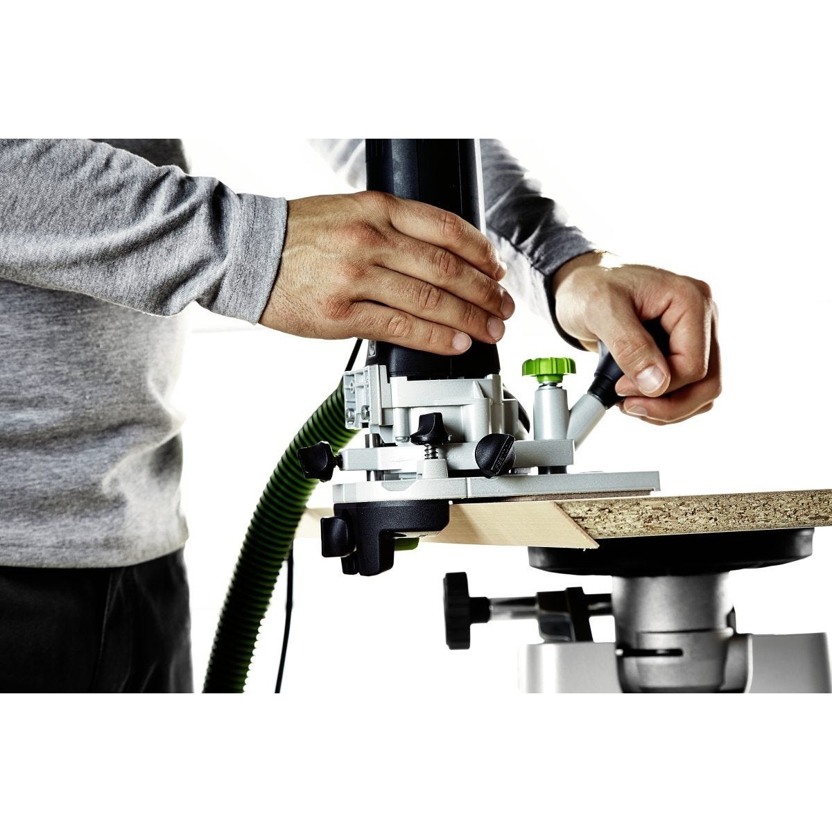 Festool edge trimming accessory from the Deluxe Master Set refining a banded panel edge on a workbench