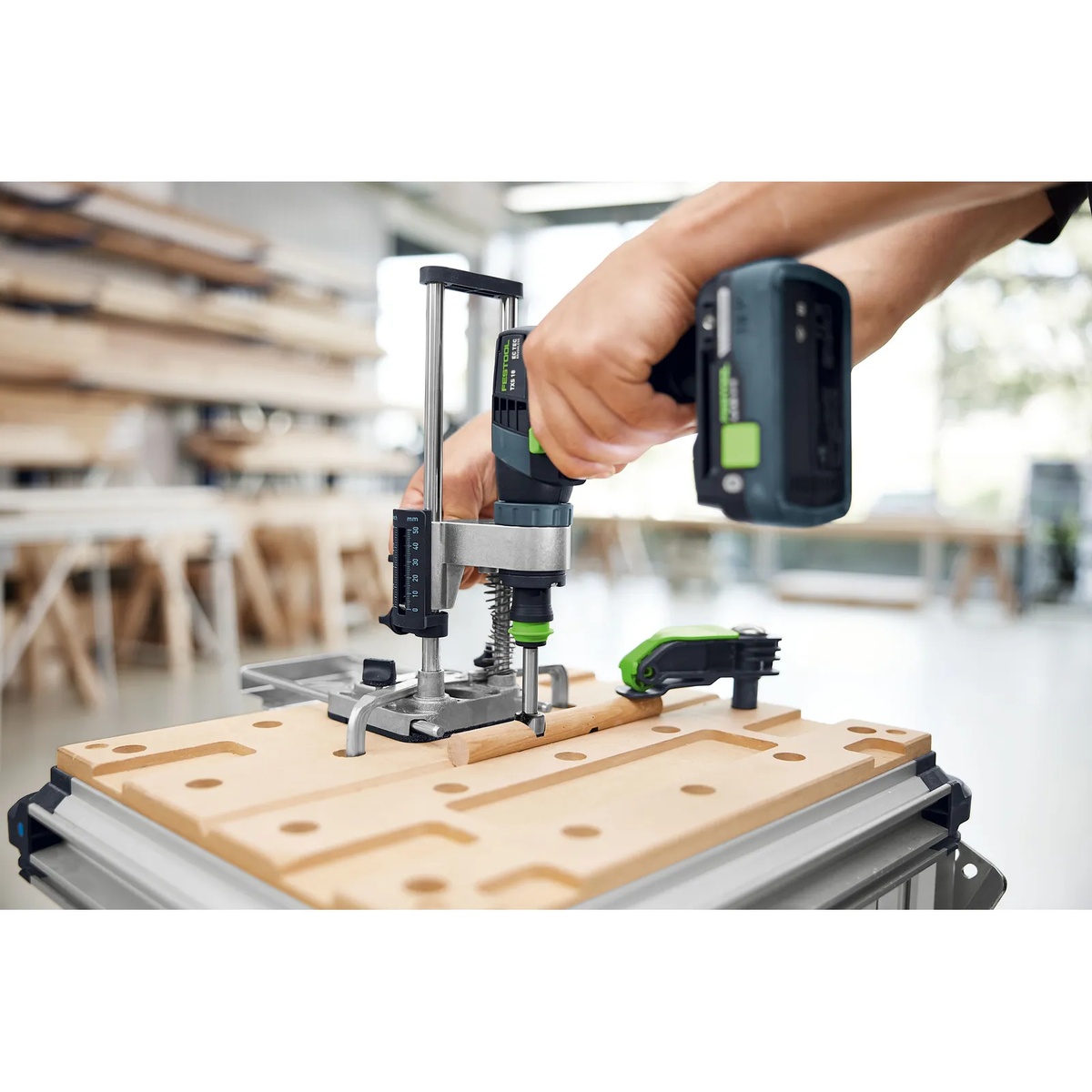 Festool MB 40 Mobile Drilling Attachment Set boring a precise depth hole in a wood dowel setup on a workbench for woodworking and joinery