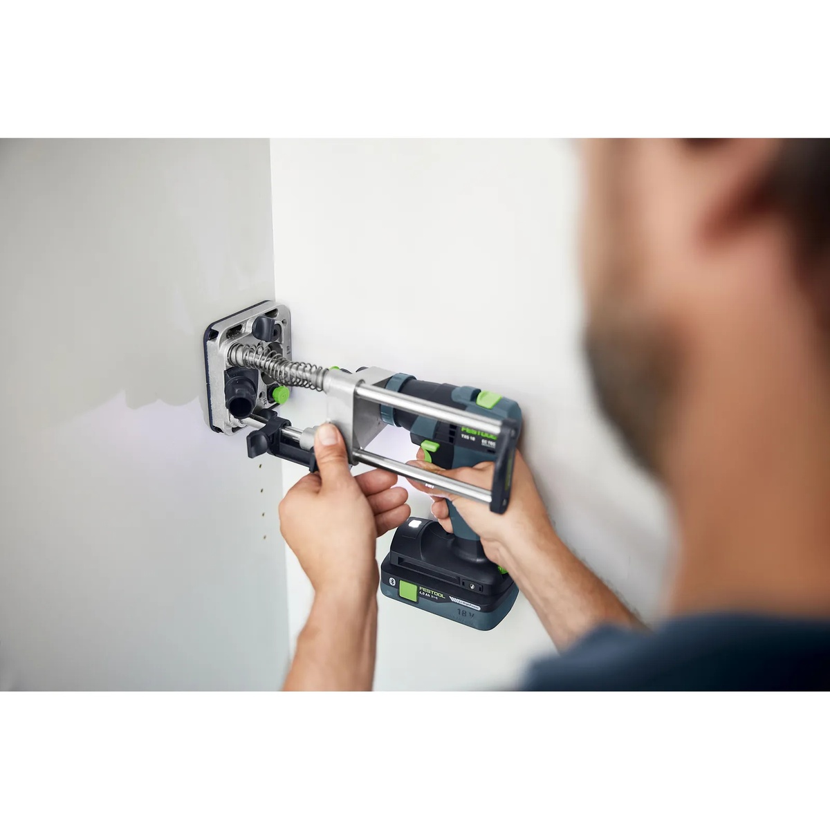 Festool MB 40 Mobile Drilling Attachment Set drilling straight into a vertical installed panel during remodeling or cabinet installation work