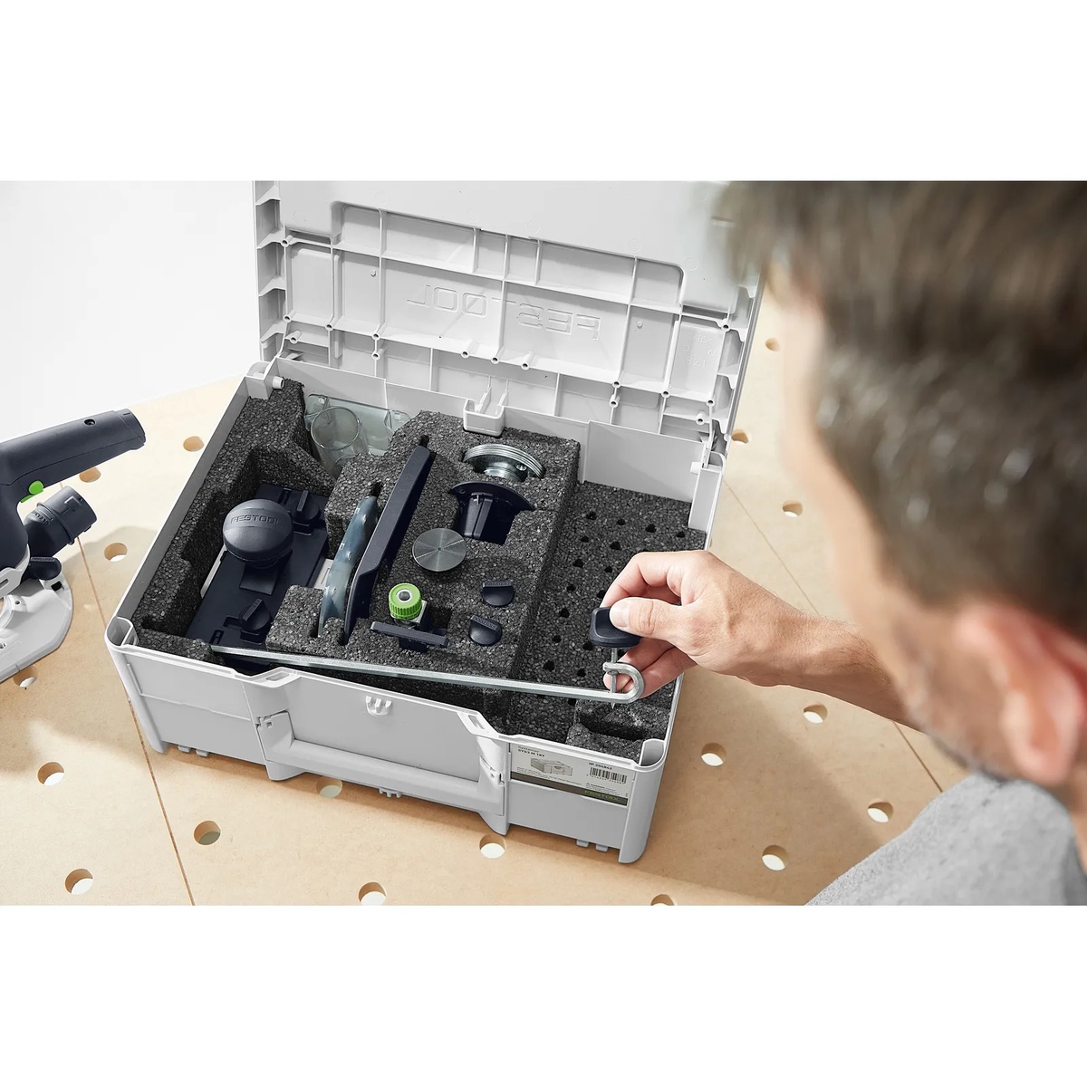 Festool 578047 ZS-OF 1010 I 17-Piece Imperial Router Accessory SYS3 Set opened on a perforated workbench with organized router accessories in foam storage for workshop setup