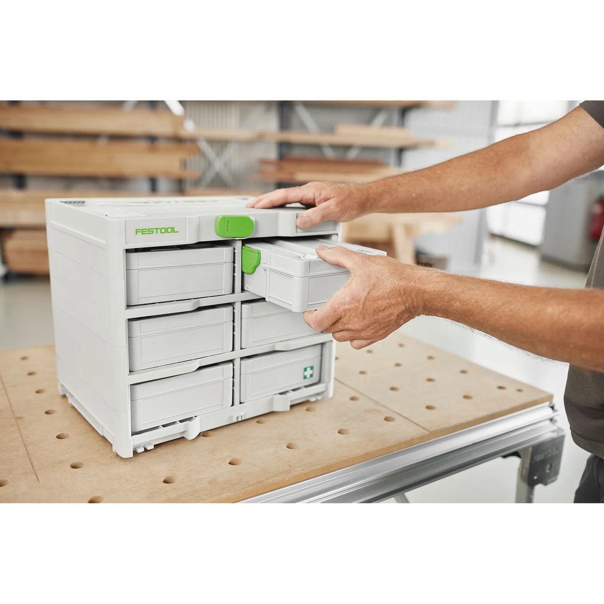 Festool SYS3 S 76 accessory case from the Festool 578112 Metric Ratchet and Socket Set sliding into a Systainer3 Rack on a workshop bench for organized transport and storage