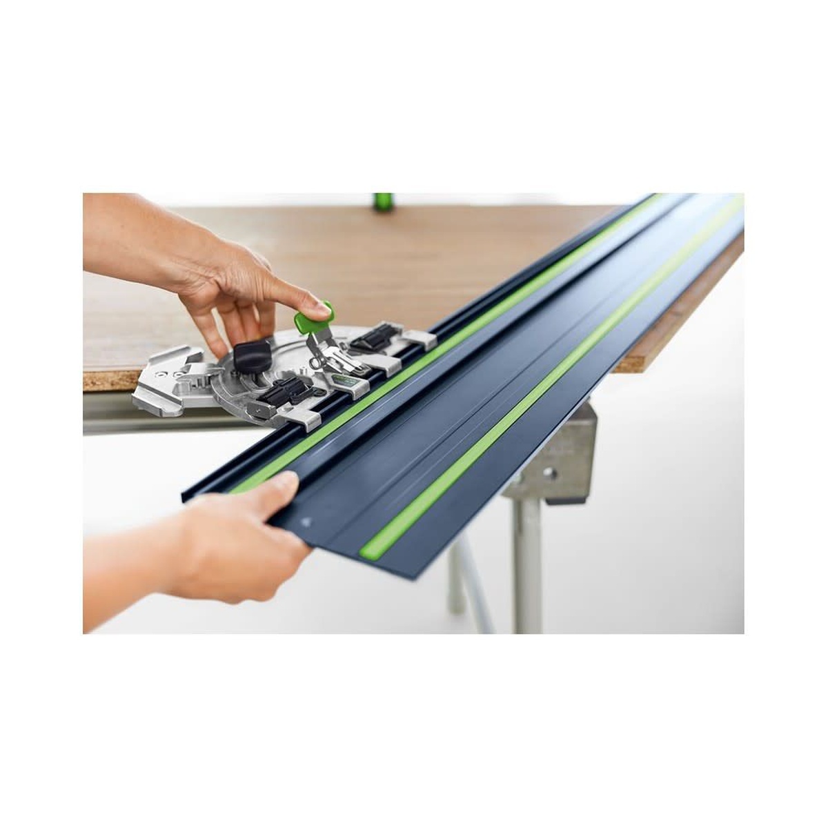 Festool 578246 FS 1400 Limited Edition 100th Anniversary Blue Anodized 55 inch Guide Rail being positioned with a guide accessory on a wood panel for accurate layout and guided routing or cutting
