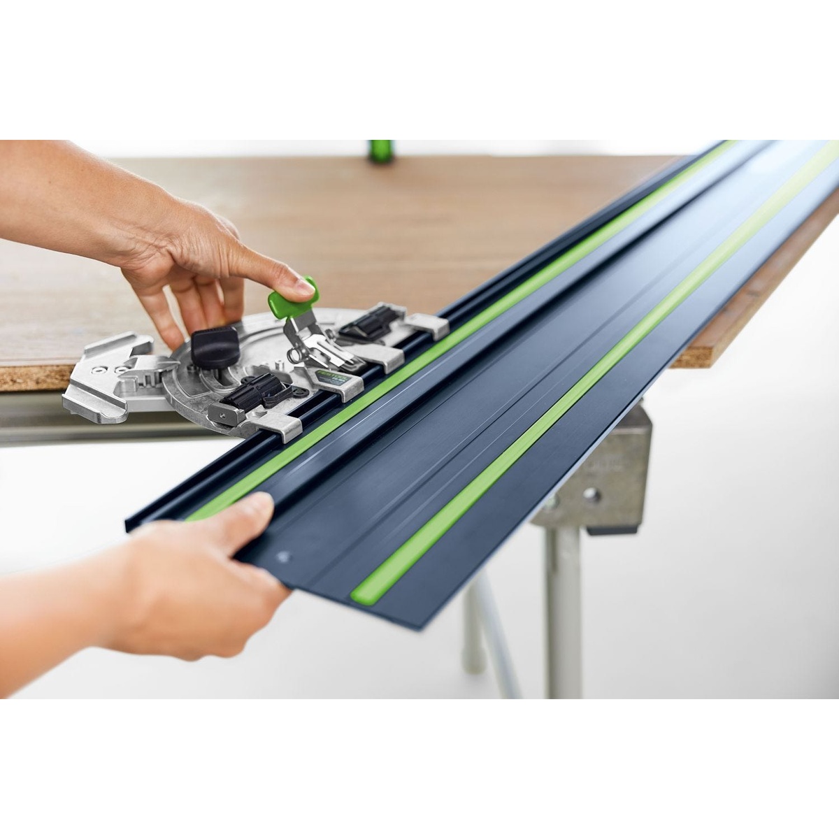 Festool limited edition blue guide rail with connector hardware being installed on a bench for joining rails for longer straight cuts