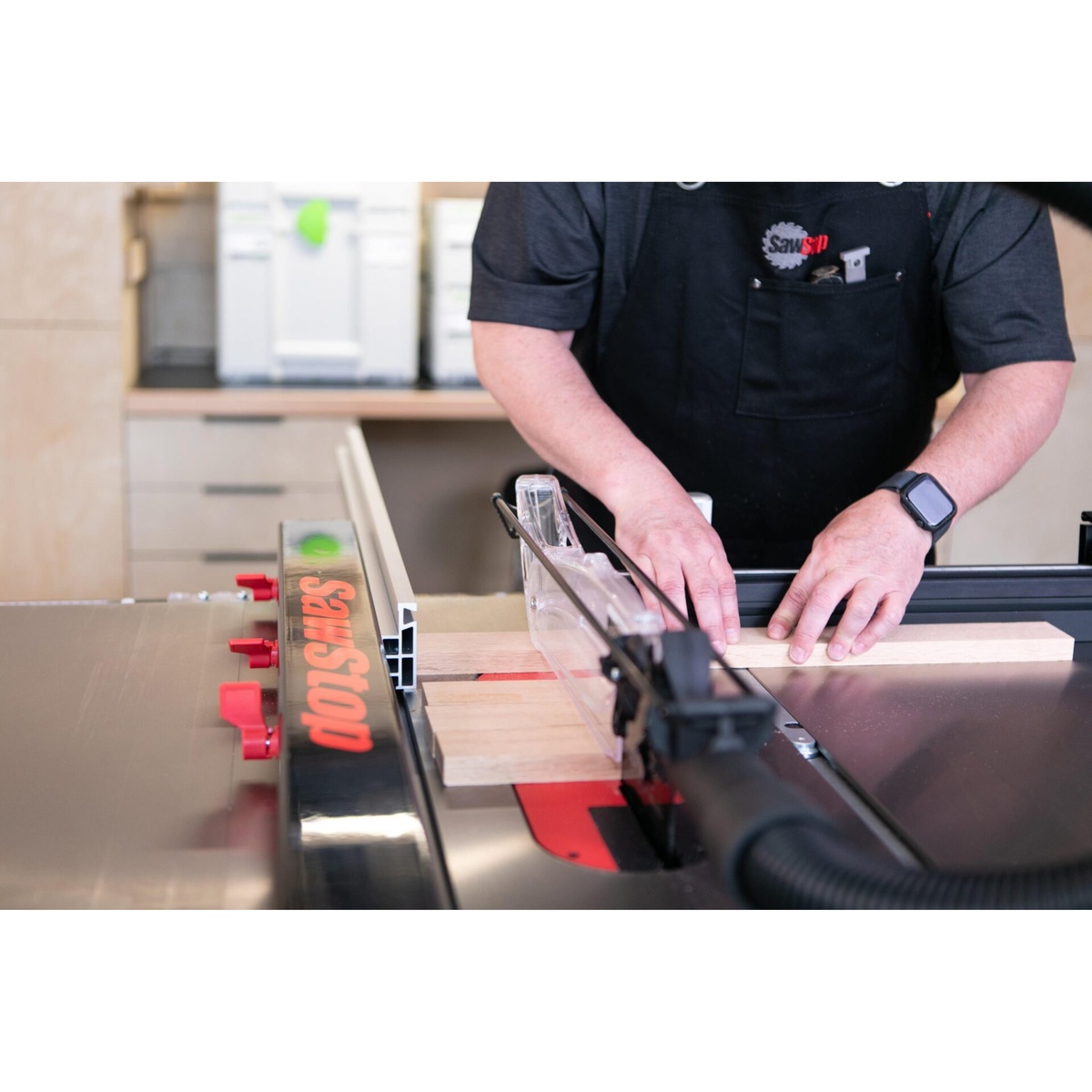 SawStop ATGP-FA Professional T-Glide Advance Rip Fence used with wood on a SawStop table saw for repeat crosscut setup in a shop