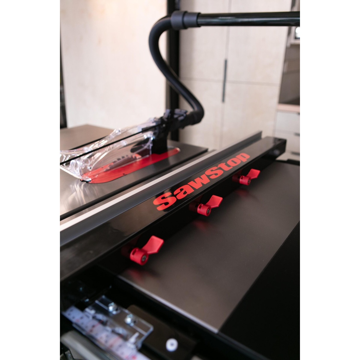 SawStop ATGP-FA Professional T-Glide Advance Rip Fence detail showing fence body and adjustment levers on a cast iron table saw top