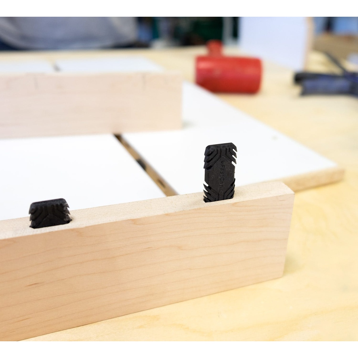 Fastcap 6mm x 38mm Fastenon for Festool DOMINO, 100-Pack installed in a wood board for loose tenon alignment in a workshop
