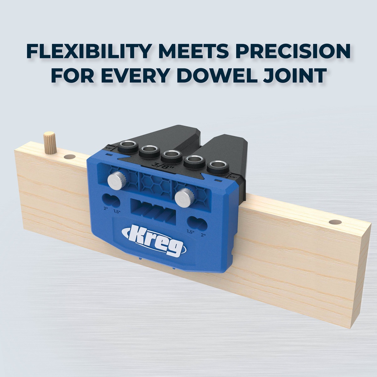 Kreg Tool KHJD345 dowel jig clamped to a wood board for drilling aligned dowel holes during woodworking assembly and panel joinery