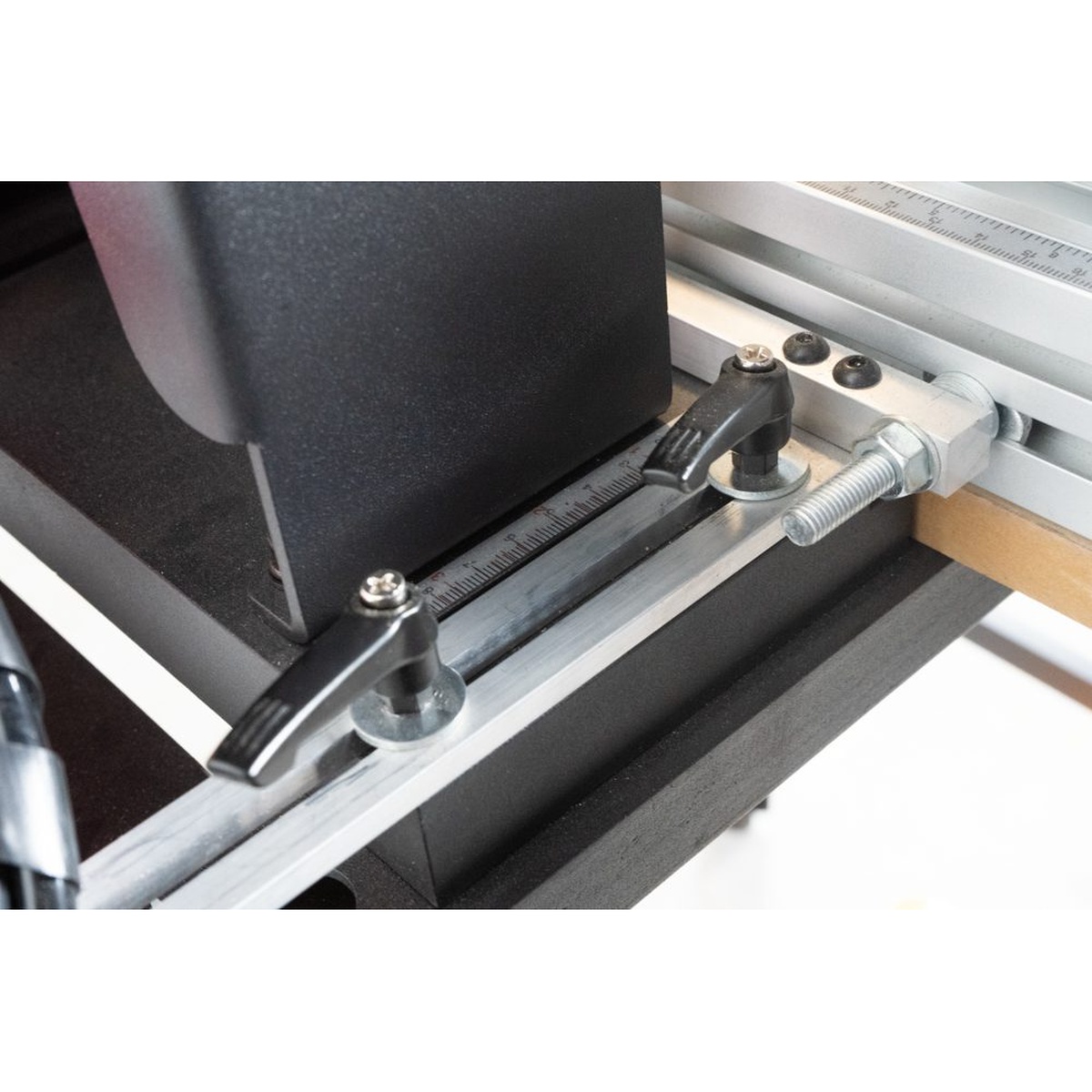 Close-up of the Maksiwa LBP.13 Pneumatic Line Boring Machine fence scale and locking adjustment for repeat woodworking setups