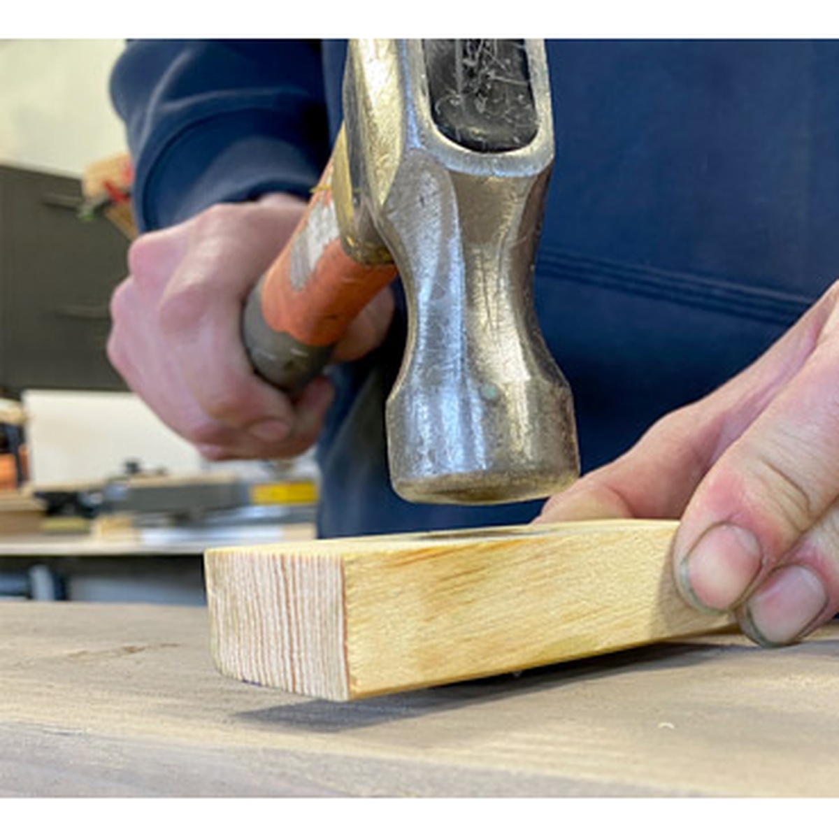 FastCap Mortise Marker for Festool DOMINO DF 500 being tapped with a hammer to transfer a mortise location onto a wood workpiece