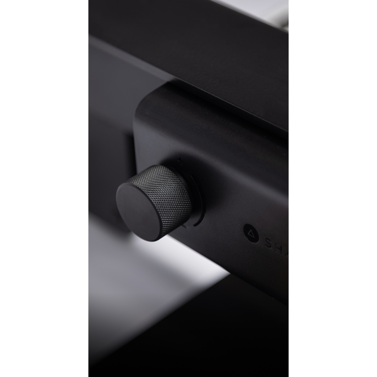 Close-up of the Shaper SCFP1-AJ-NN BenchPilot Hands-Free CNC Bench for Origin feed rate control knob used to adjust automated routing speed in a woodworking shop