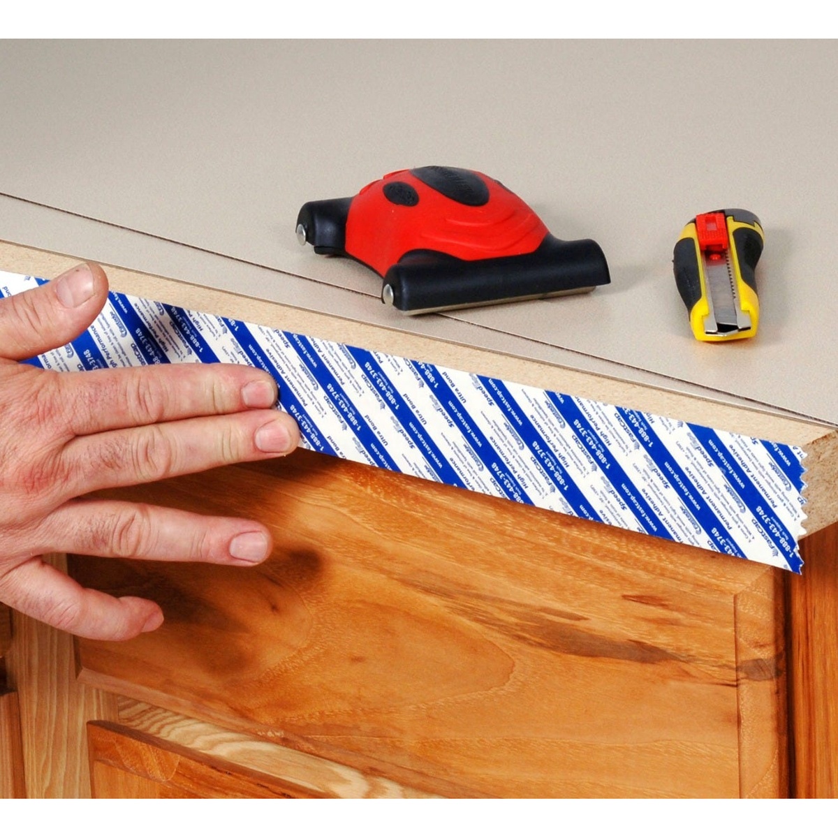 Fastcap SpeedTape 3/4-in. x 50-ft. for Edgebanding applied along a cabinet panel edge during woodworking prep before the liner is removed