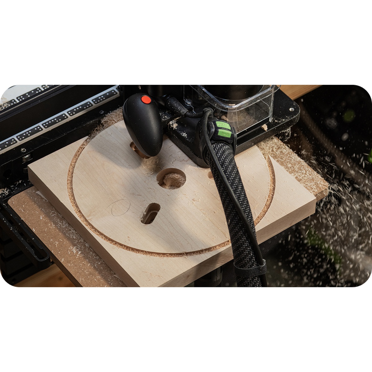 Shaper SU1-WSUK1 Origin Workstation Shelf Upgrade Kit supporting a wood workpiece while a router cuts a circular pattern with dust collection attached