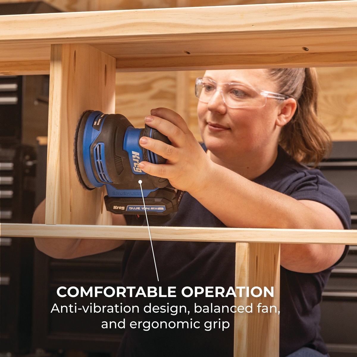 Kreg Tool KPTRS500A Brushless Random Orbital Sander sanding a vertical wood cabinet frame in a workshop during finish prep