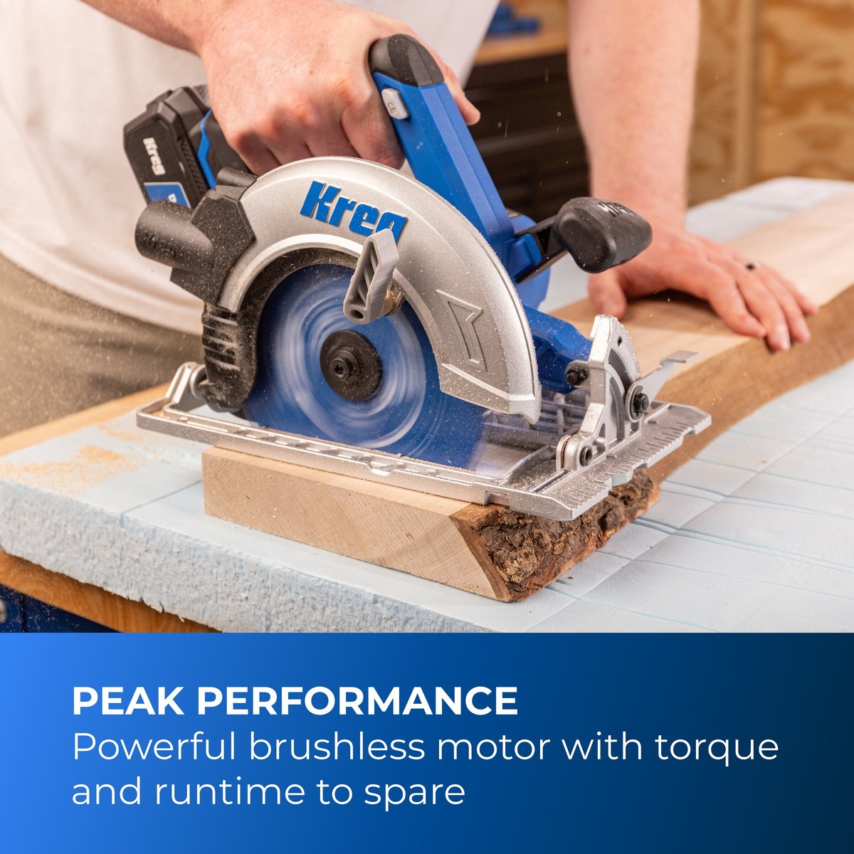 Kreg Tool KPTCS725A cordless circular saw cutting through a wood board on a work surface during active jobsite-style carpentry use