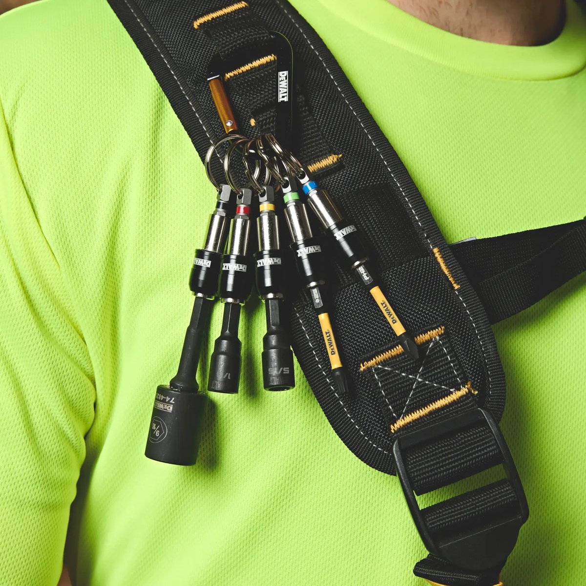 DEWALT Keyring Bit Holder Set clipped to a shoulder strap with nut drivers and bits ready for field service and installation work